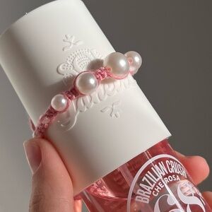 Handmade woven friendship bracelet pink with fake pearl beads